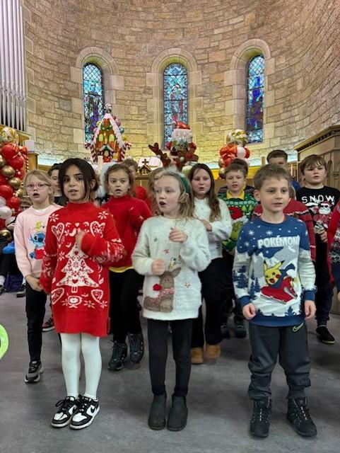Aberlour Christmas Performance showing children singing in the local church 