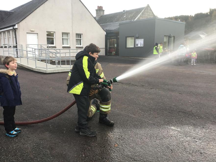 Outdoor Learning P 4 5 Firestation Visit - using a fire hose